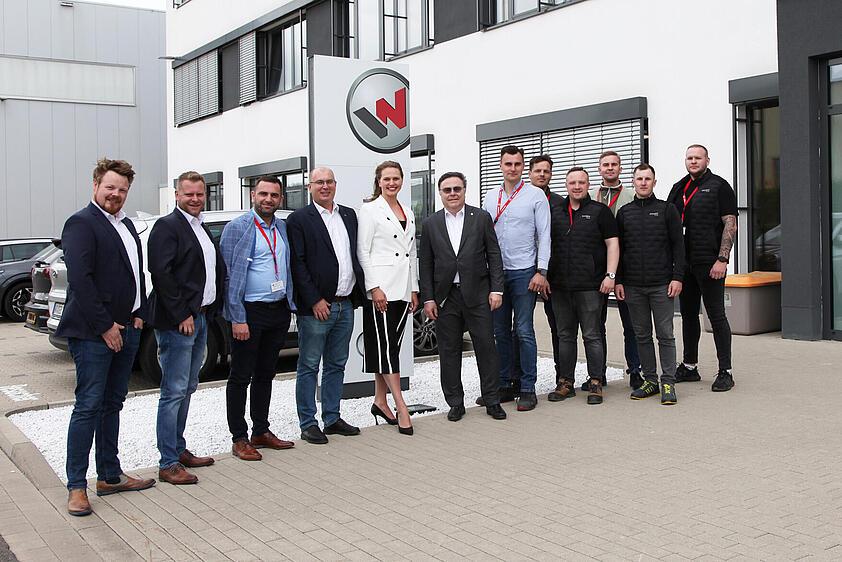 group of people standing in front of a building