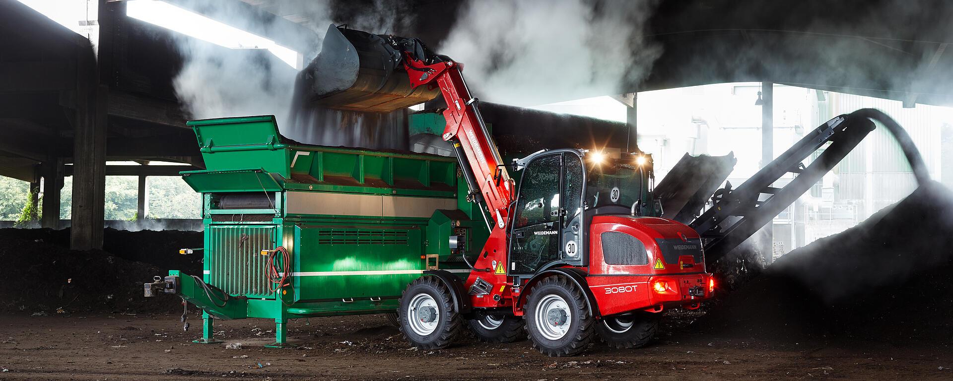 Weidemann telescopic wheel loader 3080T cabin with cargo bucket in action