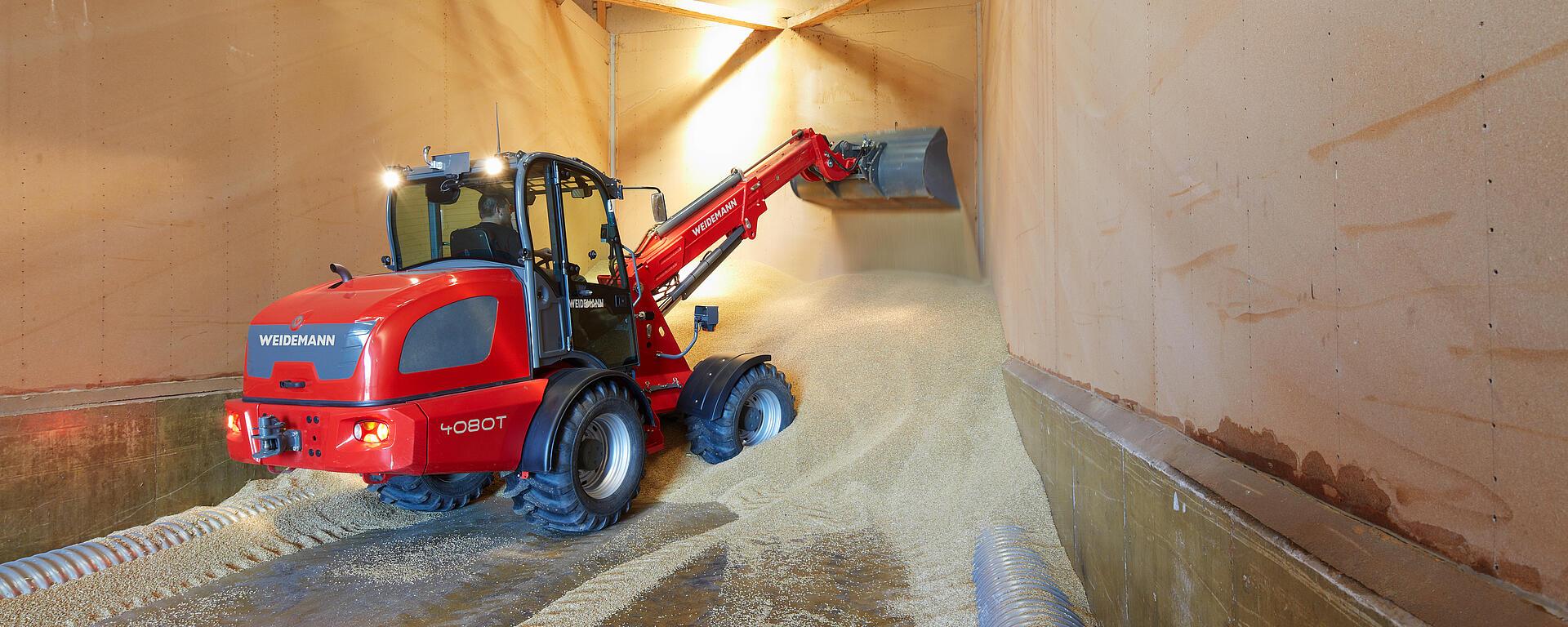 Weidemann telescopic wheel loader 4080T cabin with cargo bucket in action